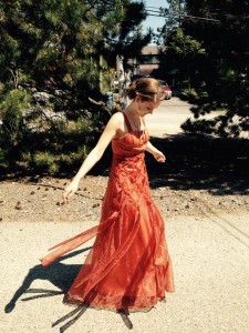 Jessi at 17 wearing a 1 of a kind grad dress with pride